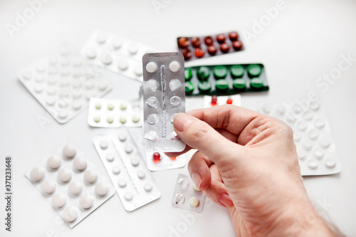 Photos Hand with a Pills
