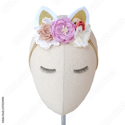 Handmade flowers as headband hair accessory with cat or kitty ears as decoraiton in soft pastel colors photo