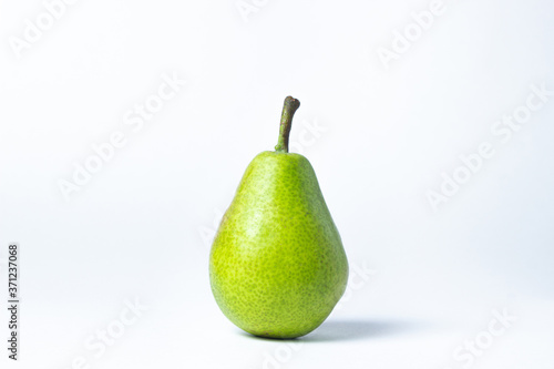 Green pear on a white background. Summer harvest. healthy fruits