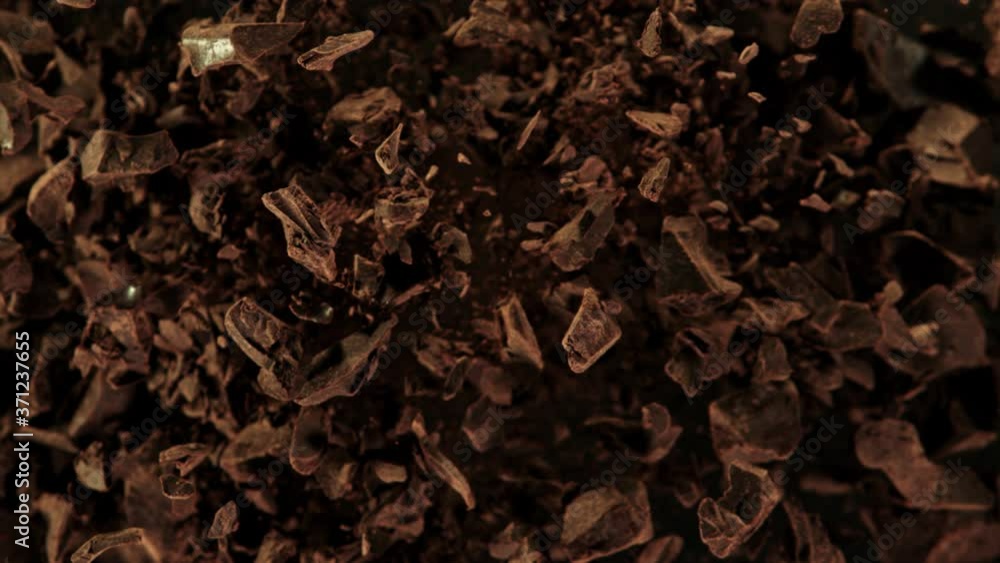 Super Slow Motion Shot of Raw Chocolate Chunks and Cocoa Powder after Being Exploded at 1000fps. Super Slow Motion Shot of Raw Chocolate Chunks and Cocoa Powder after Being Exploded at 1000fps.
