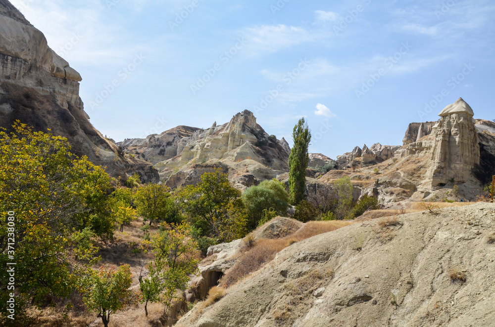 Amazing landscapes, ancient cave homes and rock formations in colourful Pigeon Valley in Cappadocia, Turkey. Traveling the world concept Amazing landscapes, ancient cave homes and rock formations in colourful Pigeon Valley in Cappadocia, Turkey. Traveling the world concept