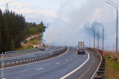 car accident with a burning car and smoke