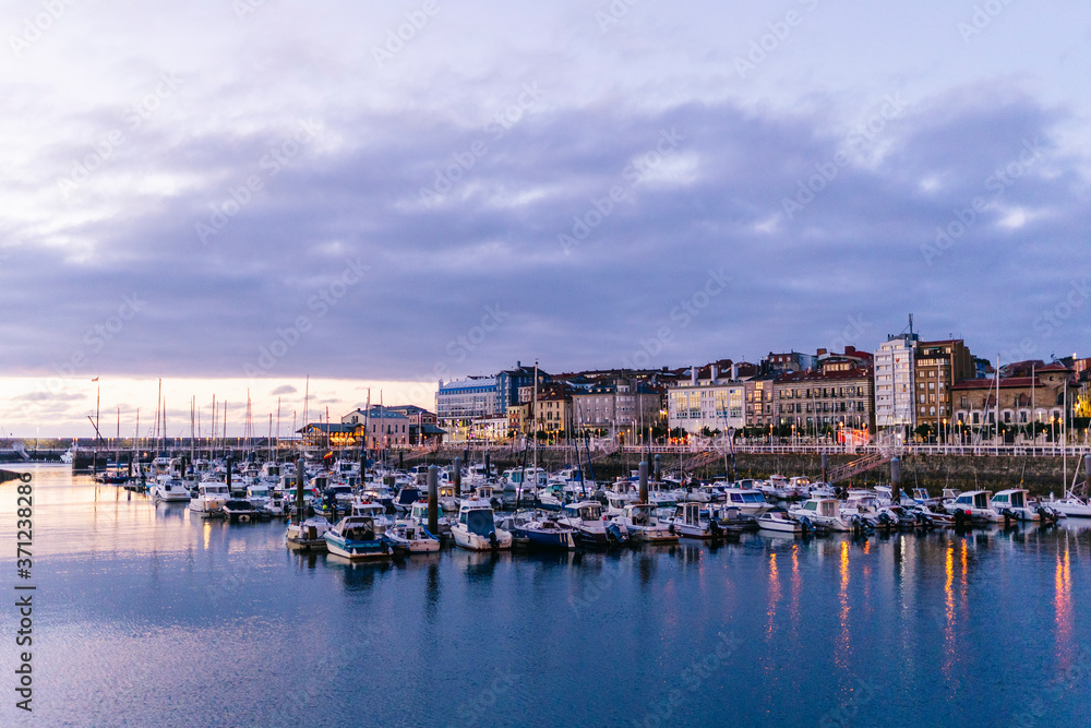 View of the marina of Gijon, Asturias, Spain. High quality photoPanoramic view at dusk of the marina of the city of Gijon, in Asturias, northern Spain