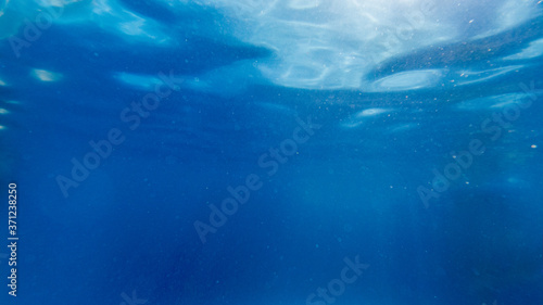 View from underwater with a calm surface © Ruben Chase