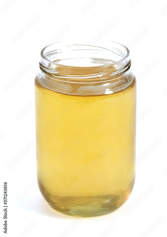 Jar of Honey against White Background Jar of Honey against White Background