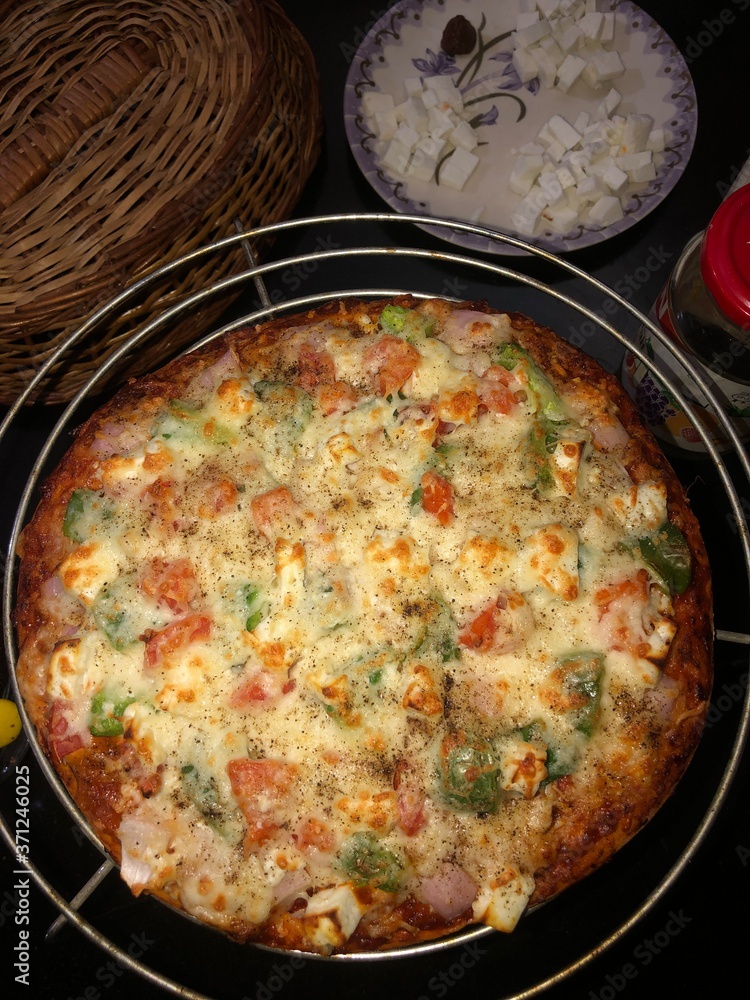 Homemade Yummy and tasty cheesy vegetable pizza in lock down Homemade Yummy and tasty cheesy vegetable pizza in lock down