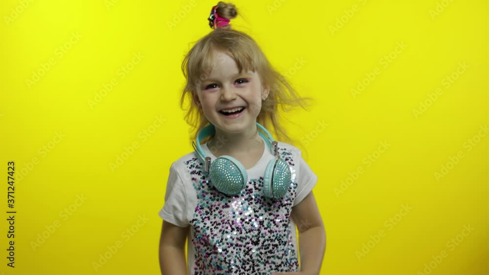 Joyful child laughing out loud with tears, feeling carefree joyful after hearing funny, silly joke Joyful child laughing out loud with tears, feeling carefree joyful after hearing funny, silly joke