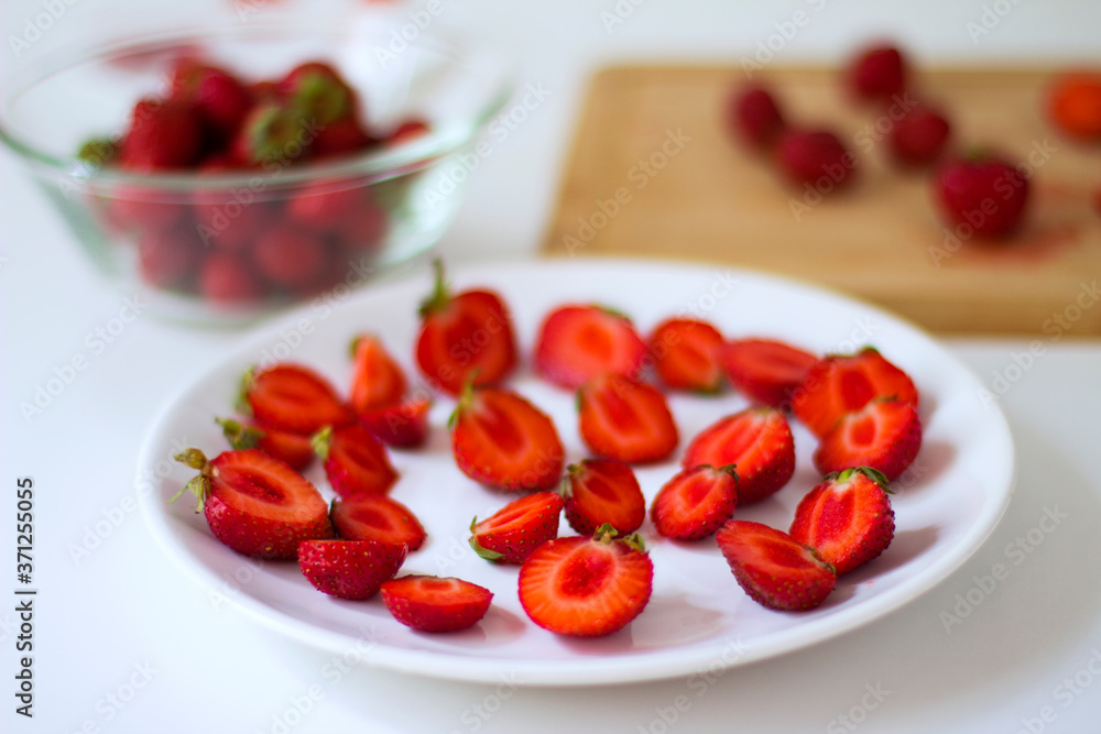 Sliced strawberries on plate on white background.
Diet food, vegan menu, homemade cake ingredients.
Sliced strawberries on plate on white background.
Diet food, vegan menu, homemade cake ingredients.