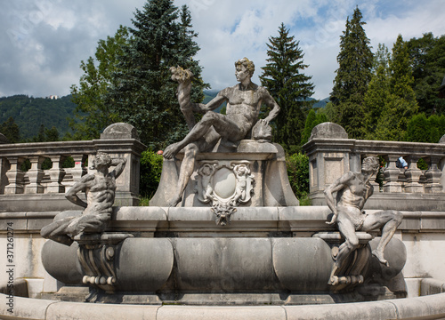 Beautiful park with marble statues in Peles castle, Sinaia, Romania