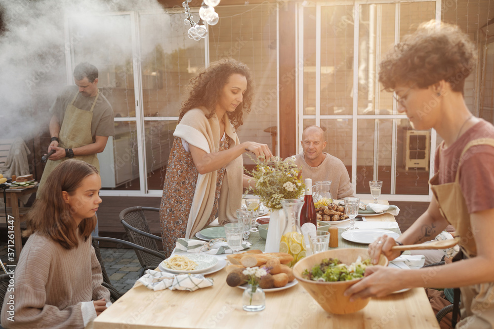 Two Attractive Women Setting Table Two Attractive Women Setting Table