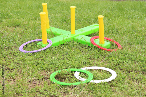 children's play ring toss on green grass