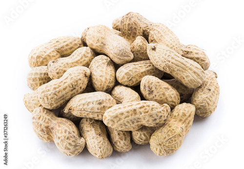 Close-up of delicious peanuts isolated on white background