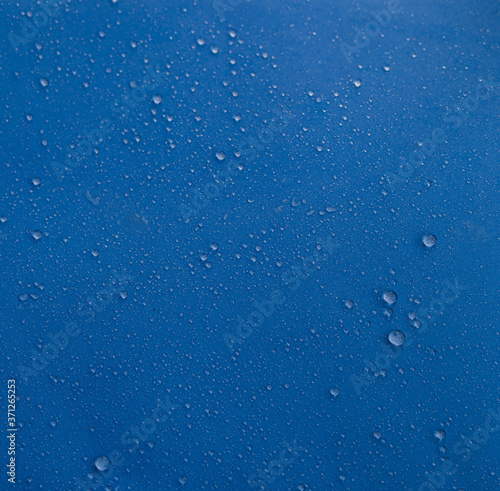 Water drops on a blue background. Clean water