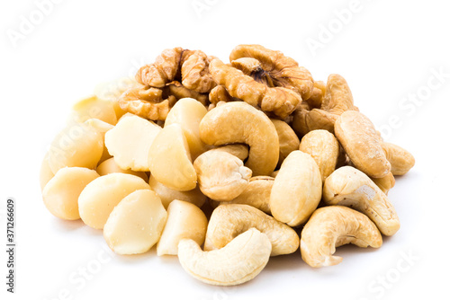 Variety of fresh nuts on the white background