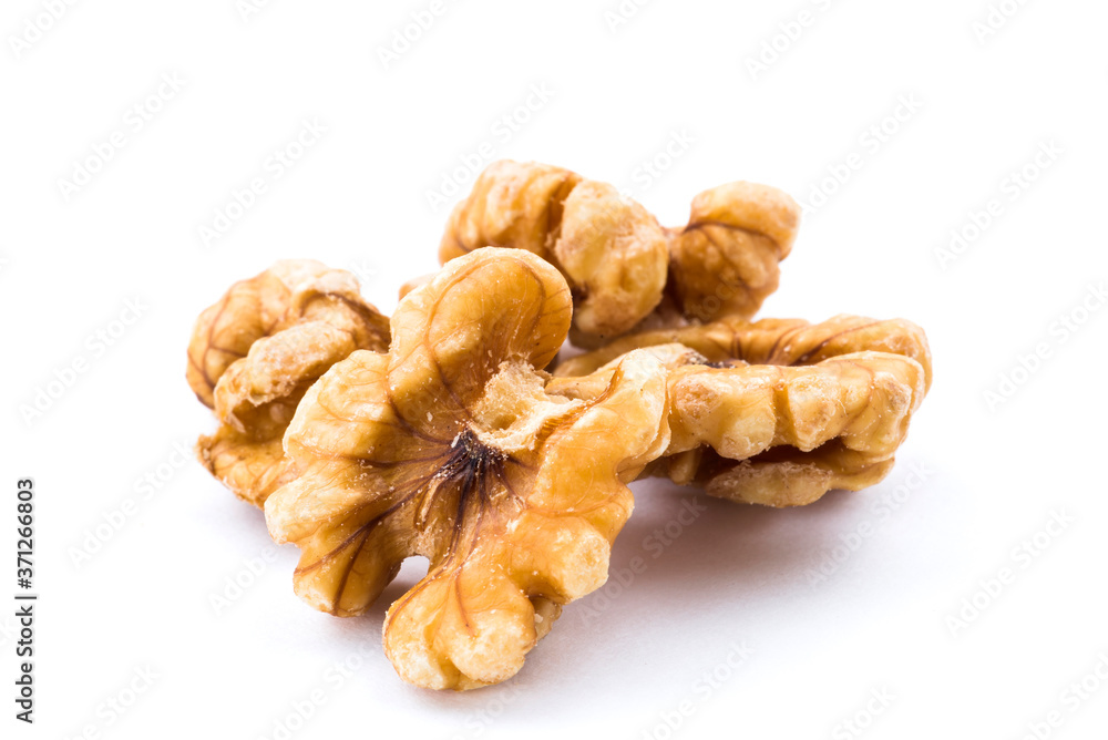 Close-up of delicious walnuts on the white background Close-up of delicious walnuts on the white background