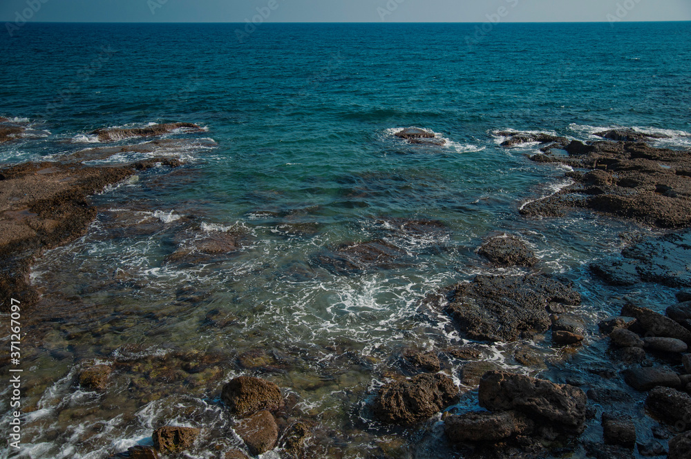 beautiful sea with large stones near the shore and turquoise water beautiful sea with large stones near the shore and turquoise water
