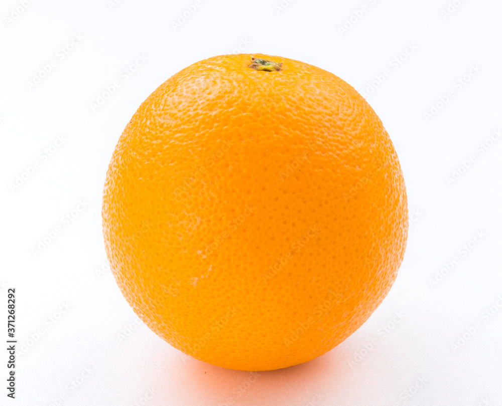 Close-up fresh Sunkist orange on the bright background Close-up fresh Sunkist orange on the bright background