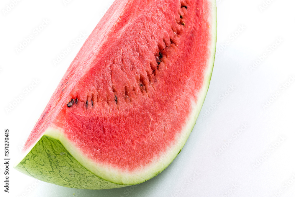 Slice of watermelon isolated on bright background Slice of watermelon isolated on bright background