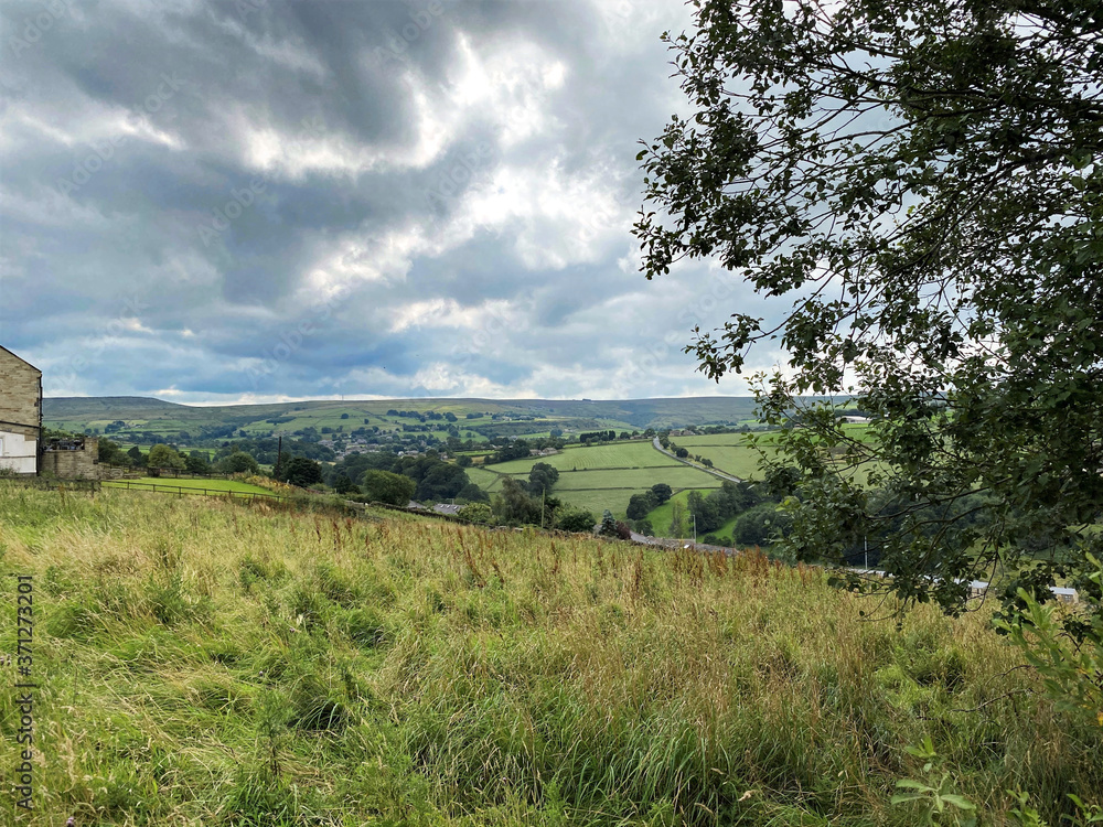 View from the hills near Haworth, with trees, valleys and farmhouses, with heavy clouds near, Haworth, Keighley, UK View from the hills near Haworth, with trees, valleys and farmhouses, with heavy clouds near, Haworth, Keighley, UK