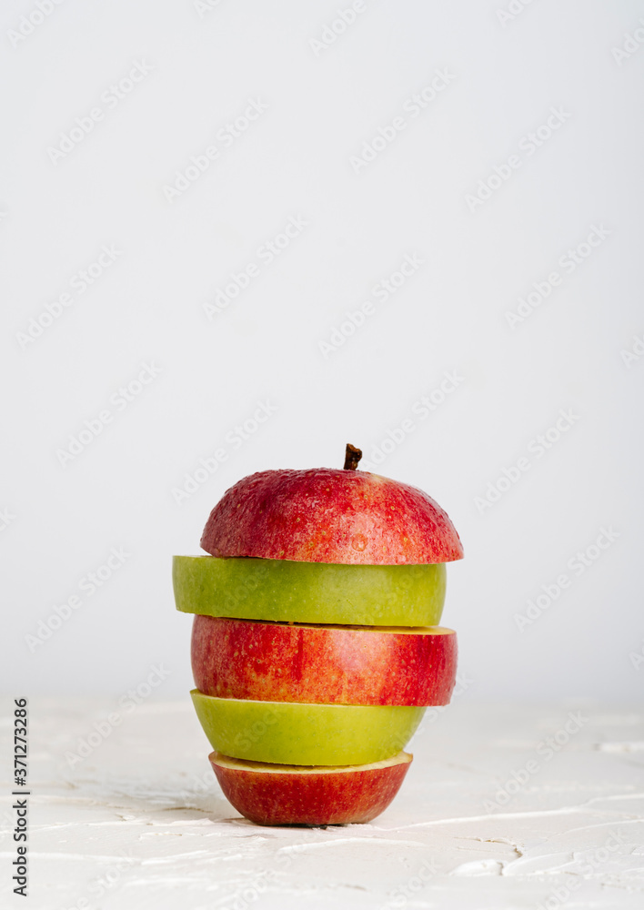 various types of apple slices of different color on white background
