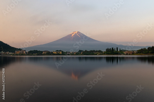 Mount fuji on a clear summer morning reflected on lake kawaguchi