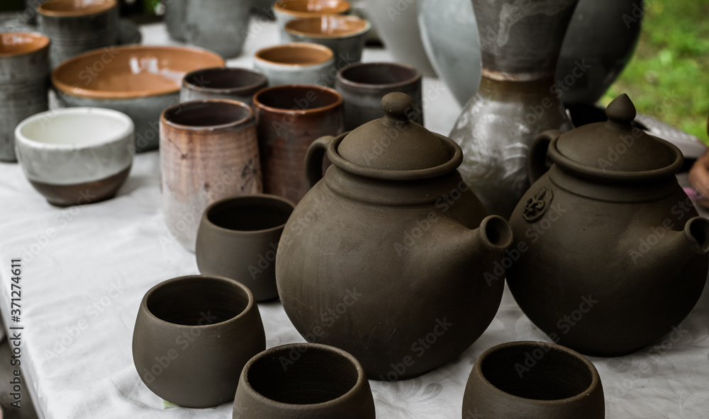 unburned clay vessels on table