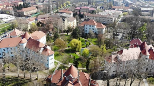 Aerial Drone Shot over above Universitatea Oradea Campus library with students photo