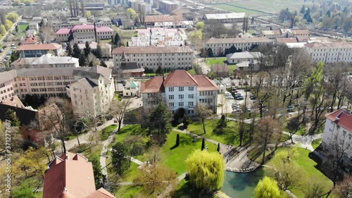 Aerial Drone Shot over above Universitatea Oradea Campus library with students photo