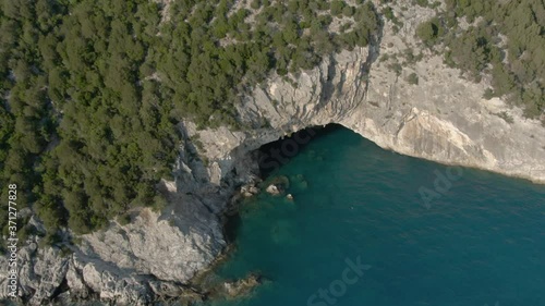 Aerial view of Papanikolis Cave on a sunny weather in Lefkada in Greece photo