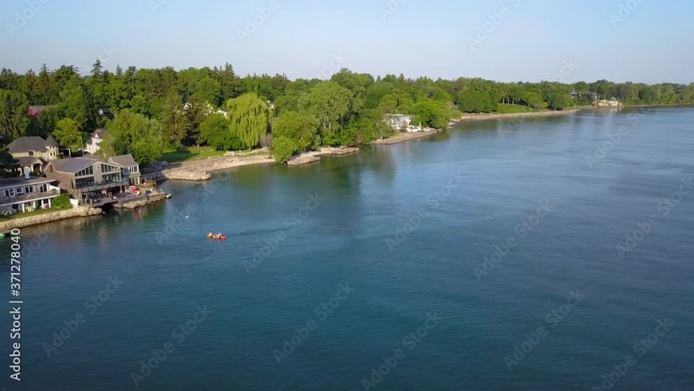 Aerial view of attractive waterfront homes in a scenic small town. Aerial view of attractive waterfront homes in a scenic small town.