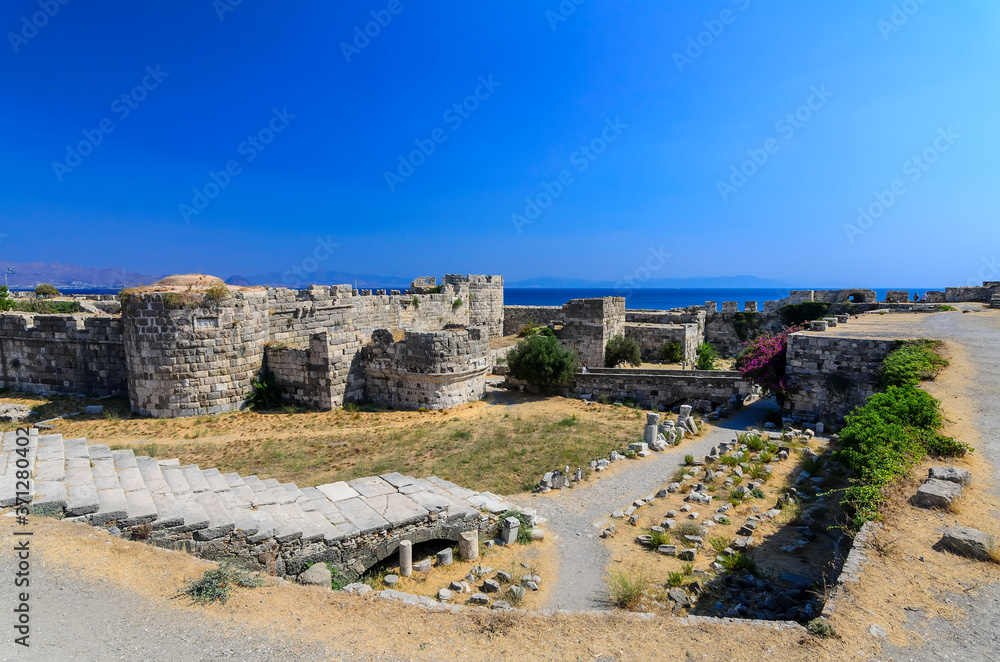 Neratzia Castle,Sculpture-strewn, 14th-century ruins of a seaside fortress featuring panoramic vistas of Kos harbor.Kos, Greece