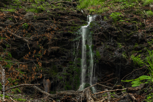 Waterfall near Kouty nad Desnou village in summer day