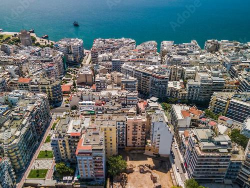 Thessaloniki, Greece aerial drone view of city center Navarino area & White Tower landmark. Day top panorama of a European city with residential buildings before a calm seafront. © bestravelvideo