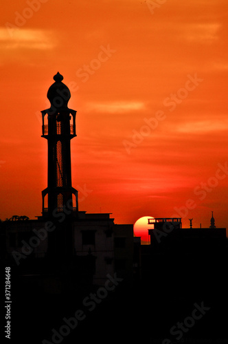 Mosque at dawn with the sun