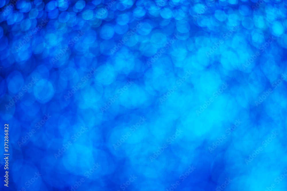 Glitter light abstract blue bokeh light blurred background
