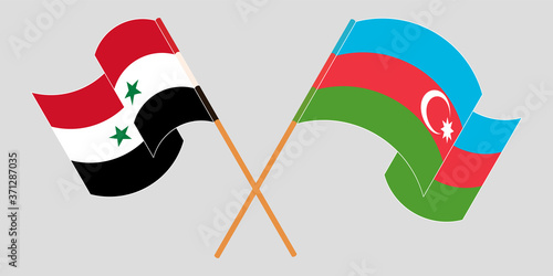Crossed and waving flags of Syria and Azerbaijan