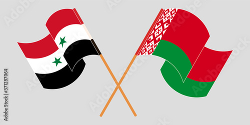Crossed and waving flags of Syria and Belarus