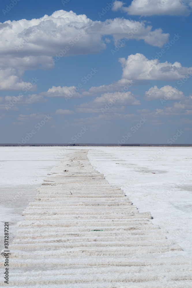 Sleepers in the salt crust on the salt lake in the village of Baskunchak in the Astrakhan region of Russia. The largest salt Deposit.space for text. Sleepers in the salt crust on the salt lake in the village of Baskunchak in the Astrakhan region of Russia. The largest salt Deposit.space for text.