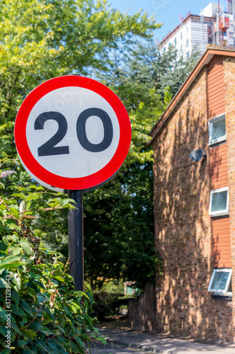 20 miles per hour speed limit with partial house in background