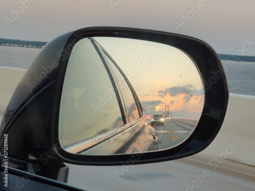 travel rearview mirror leaving vacation bridge driving road cars