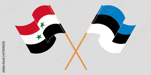 Crossed and waving flags of Syria and Estonia