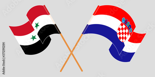 Crossed and waving flags of Syria and Croatia