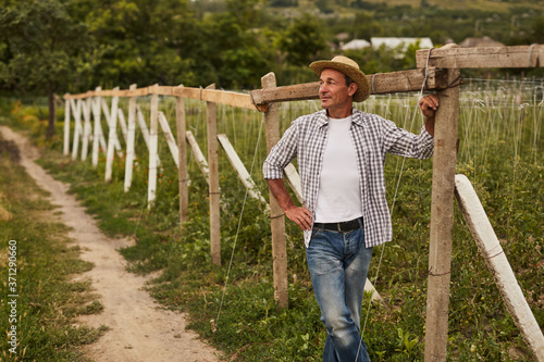 Fotografija Mature rancher resting on farm