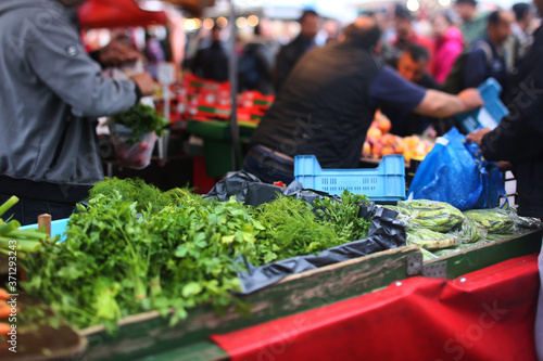 The open-air market. Fresh greens on the counter. photo