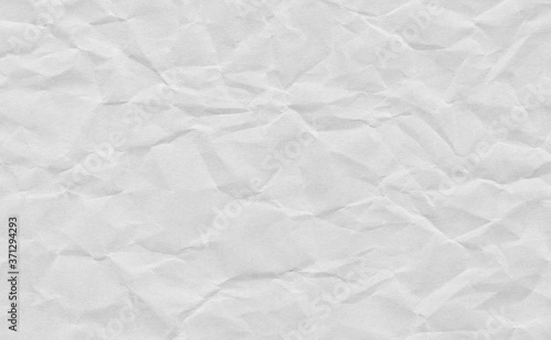 Closeup crumpled grunge grey paper texture background. Light grey paper sheet with space for text ,pattern or abstract background.