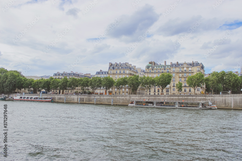 embankment along the Seine river, panoramic view of Paris