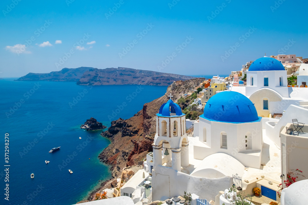 Blue dome church and the Sea in Oia, Santorini, Greece, Aegean Sea.