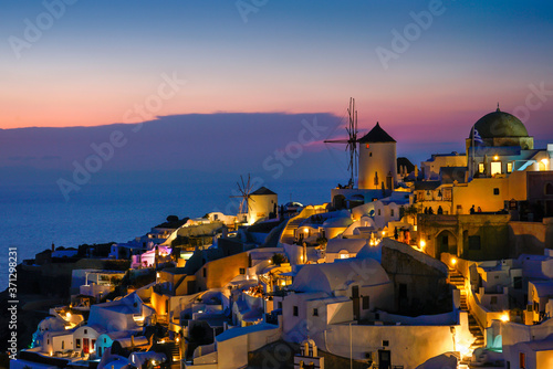 famous view over the village of Oia at the Island Santorini in twilight time, Greece, Europe, Traveling concept
