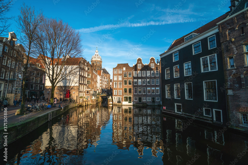 Amsterdam canal in sunny day, Amsterdam is the capital and most populous city in Netherlands. Amsterdam is the capital and most populous city in Netherlands.