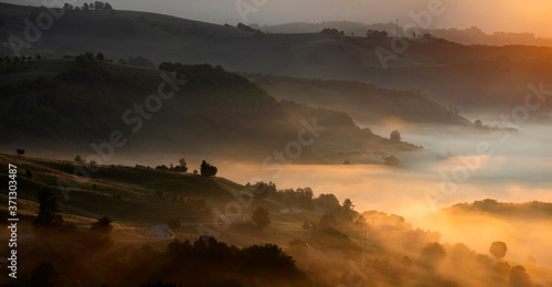 Magic sunrise in a Carpathian mountain valley
